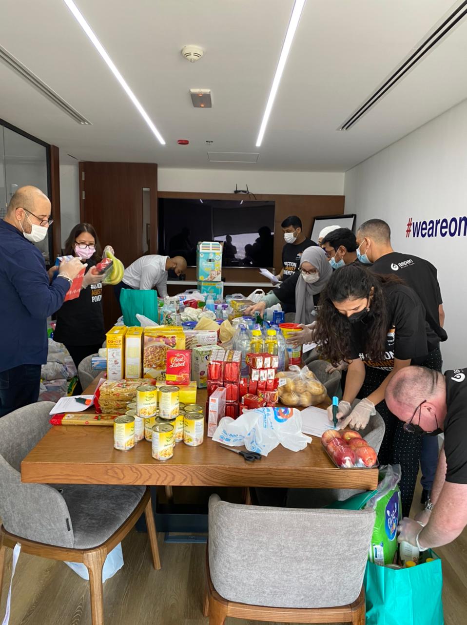 AHC-MENA-team-packing-groceries-e7bd3cc3 AHC-MENA-team-packing-groceries-e7bd3cc3